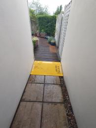 Portable ramp in place on pathway to rear guest room, garden terrace and Breakfast Room