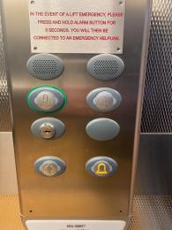 Image shows lift button, which are raised. 
