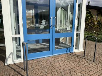 Double, glazed, manually operated doors to the Environment Centre