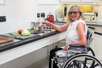 Rise and fall worktop , with sink and hob suitable fro wheelchair user .