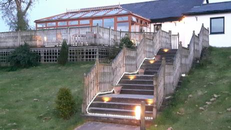 Flight of decking steps up to Robin Hill Farm Cottages leisure facilities