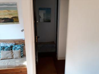 Door to living room with front door beyond