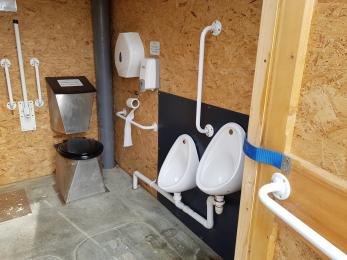 Interior of composting toilet showing urinals