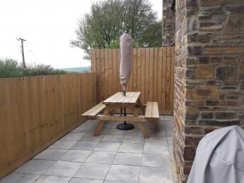 Patio with outside table and BBQ
