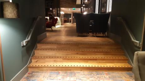 Stairs going down to the Executive Lounge, ramp available on request