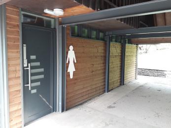 Entrance to ladies toilet and second baby change