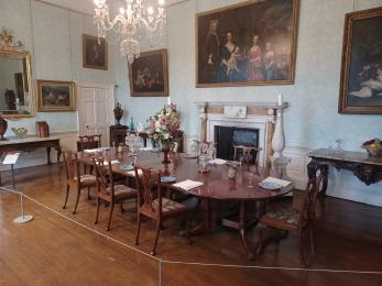Historic dining room on ground floor with table and chairs set out