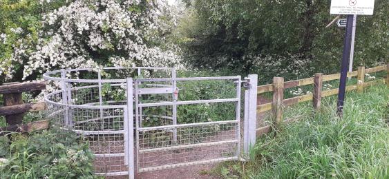 The kissing gate at the entrance to the Arrow Lane Trail