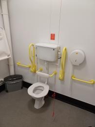 Toilet in space to change showing direction of transfer on both side
