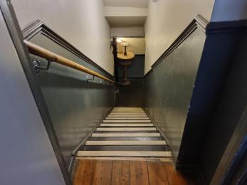 Stairs down to the basement gents and ladies toilets