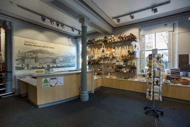Showing the information desk at the museum and the museum shop