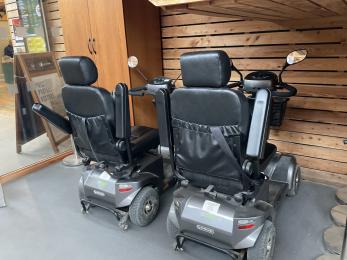 Two trampers for hire, located in the visitor centre main entrance foyer area.