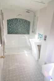 Bathroom (shower tray is very low profile and controls are outside shower next to the sink)