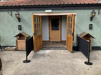 Double doors at the Bar entrance with single internal door showing level access