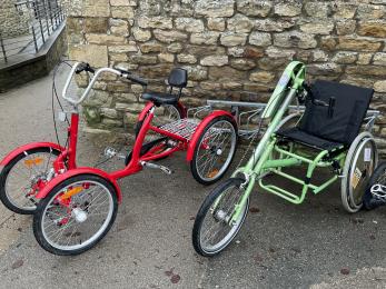 Close up of two adapted cycles outside Dalby Forest Cycle Hub.