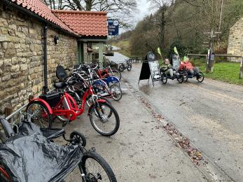 Range of adapted cycles outside Dalby Forest Cycle Hub.