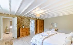 Stone wall with white door surround in bedroom