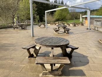 Picnic area outside the back of the visitor centre including wheelchair accessible picnic benches.
