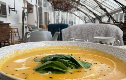 Bowl of homemade soup in the Vinehouse Cafe with the cafe interior in the background..