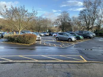 Visitor centre accessible car parking spaces with yellow hatching