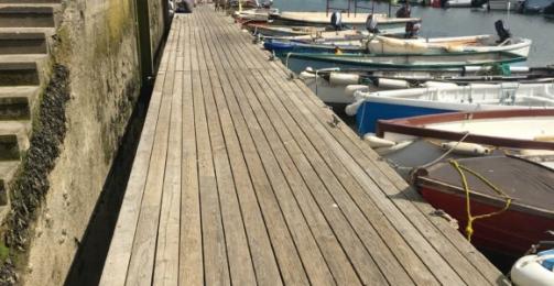 Wooden floating pontoon access to the sailing boats at Mylor Sailing and Powerboat School Falmouth Cornwall