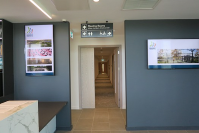Access route to a disabled toilet with baby changing facilities, further toilet and meeting rooms viewed from the Reception Desk