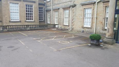 Accessible parking and drop off point at top car park next to Hall