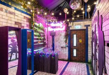 The interior of Art of Being Normal with disco lights and tiled walls