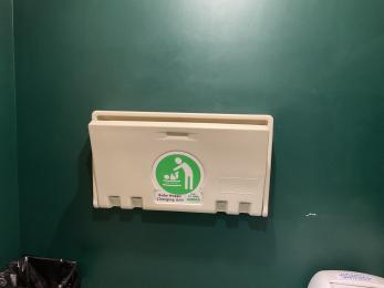 Fold down baby changing table inside accessible toilet
