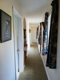 Corridor leading to all bedrooms.  Family room is at the far end