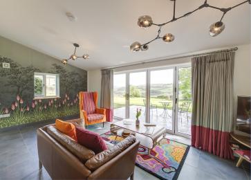 View showing lounge and terrace beyond bi-fold windows
