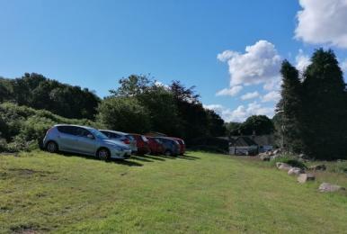 Car parking area for campsite, slopes about 20% from left to right.  