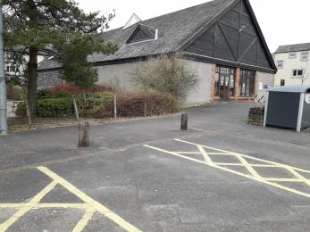 Accessible Car Park Spaces with dropped kerb up to building