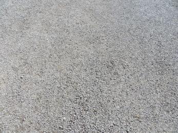 Church Centre car park surface of packed small limestone chippings