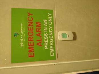 Emergency alarm in the toilet and changing area.