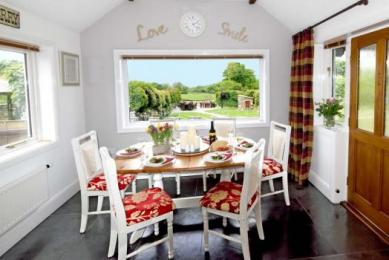 Dining Room overlooking garden and meadow at Meadowview Cottage a luxury cottage Cornwall