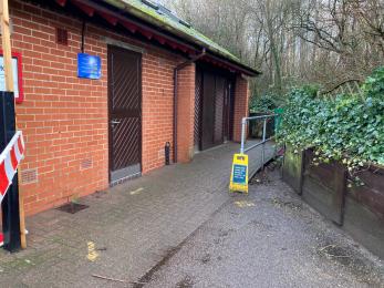 Walkway to disabled toilet which has a small but not steep ramp