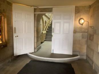 The single step with double doors at the other side of the Entrance Hall 