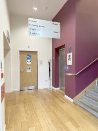 The ground floor entrance area showing the lift to the museum, stairs and accessible toilet.