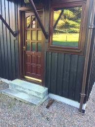 Forestry House 7, back door with 2 steps to property