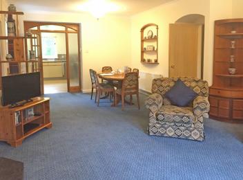 Foresters Lodge lounge has door to main hallway right, door to second hallway, left and door to kitchen