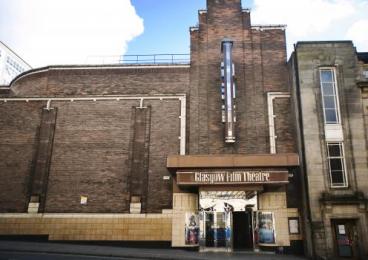 Front of the Glasgow Film Theatre, a brown brick  1930's art deco building with Glasgow Film Theatre written above the entrance