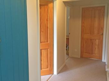 Entrance door and hallway leading to bedrooms