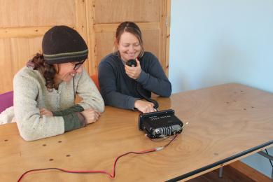 Classroom photo with 2 girls on a VHF radio course at Mylor Sailing and Powerboat School Falmouth Cornwall