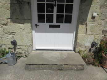 Front door to  property with step 190mm in height