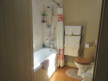 Master Bedroom en-suite with shower over bath - lip of bath 560mm from floor