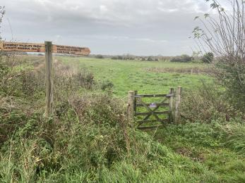 Wooden field gate and finger post