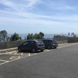Tarmac car park with accessible parking spaces