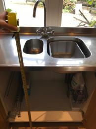 Kitchen sink with under cupboard cleared, 900mm high.