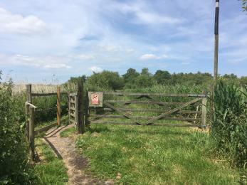 Kissing gate and five-bar gate entry to Avalon Hide path